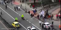 Skaters jump a Colombian Officer (R)