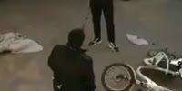 Kneeling Bicycle Thief Gets Beaten In China