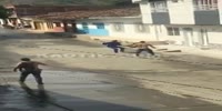 Men armed with machetes fight in the streets of Roldanillo, Colombia (R)