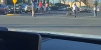 Man lays dead in the street after being hit by a car