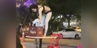 Woman On A Table Taking a Beer Shower!