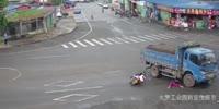 Biker Slides Under Truck (R)