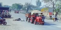 Dude Rams A Tractor & Lands On The Road Head First