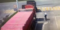 Red Truck Crushes Cyclist In China