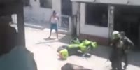 Stupid Woman Attacks Police Motorcycle & Gets Tasered In Colombia