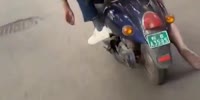 Casually Riding a Motorbike With a Dead Woman