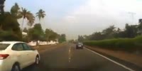 Stupid Biker Causes Car to Rollover