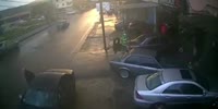 Two Knocked Down by Hydroplaning Car