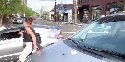 Protester + Car = LOL