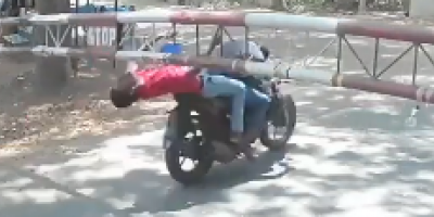 Pillion Rider Clotheslined at a Checkpoint