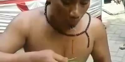 man eating nails (R)