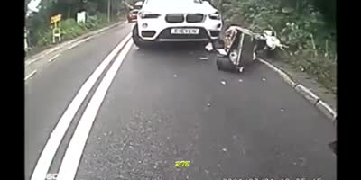 Bike Sandwiched by BMW