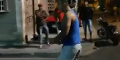 a man is knocked out for watching a street fight.(R)