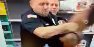 Cop suspended for slugging a woman who attempted to bite him during July 4 Walmart arrest