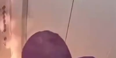 Flaming drink accident in an elevator.(R)