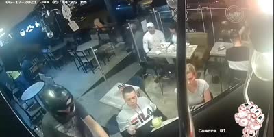 Guy continues to eat his chicken wing during robbery(R)