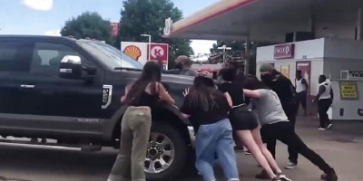 A group of assholes vs a Truck