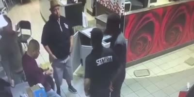 McDonald's camera records subjects fighting (R)