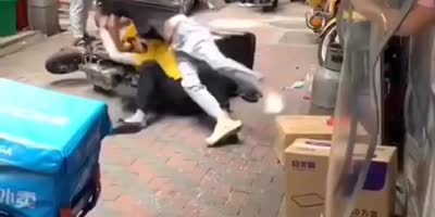 Delivery Guys Fighting With Helmets In China