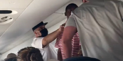 Dude FUCKED UP on Airplane