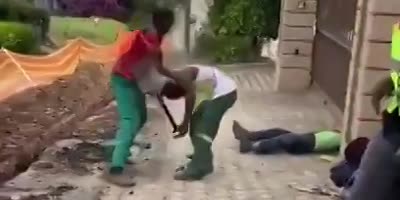 Fight Between Construction Workers With Shovel