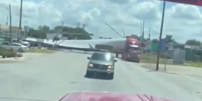 Trucks long ass trailer hit by train