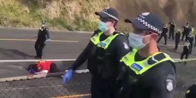 Aussie Woman Shoved To The Ground & Sprayed By Police