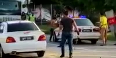 Drugged Malaysian runs amok in police station.