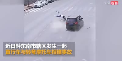 Woman on bike takes a ride into the middle of the street.