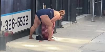 Naked lady in NYC smokes and pees in the street.
