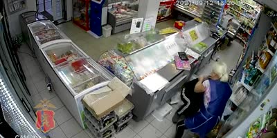 Scared Female Store Keeper Screams In Fear When Robber Pulls Out The Knife