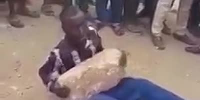 Thief Forced To Hold Heavy Stone