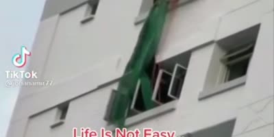 Brave Firemen Rescue a Woman About to Jump
