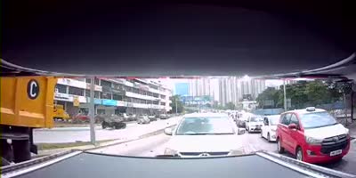 Truck lost control and the driver in yellow car had minor bruises