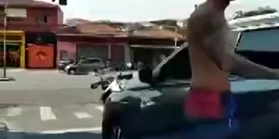 Raging Biker Damages A Car In Brazil