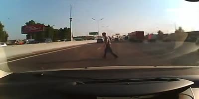 Not sure why he's walking on the highway, but...