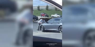 Girl Drives Off With Boyfriend On Hood Of Car