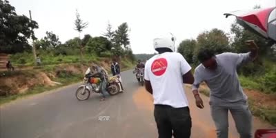 Biker vs Longboarder in Kenya