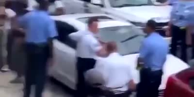 Philly cops have front row seats to this hood brawl.