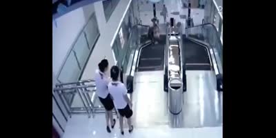 Woman Falls inside Escalator in China (R)