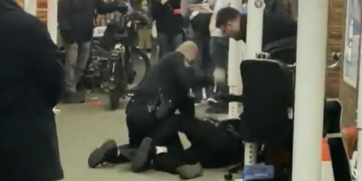 NYPD Officer Punching Handcuffed Male