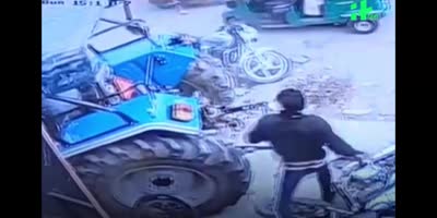 Man Narrowly Avoids Getting Crushed ByTractor In India
