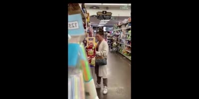 A Woman Opens Up A Bag Of Chips In A Supermarket, Eats A Few, Spits Them Back In The Bag And Reseals It.