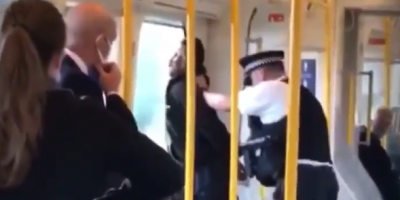 Gentleman getting attacked by policeman for not wearing a mask on a train