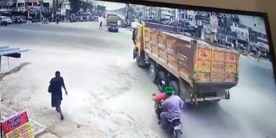 Biker Ran Over By Truck In India