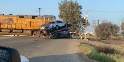 Train hits big rig trailer hauling vehicles in Central California