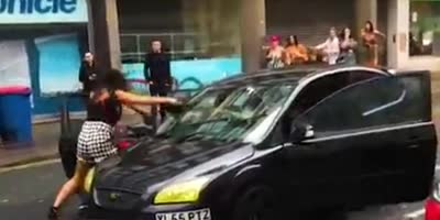WOMAN TRIES TO SMASH CAR WINDOW (R)