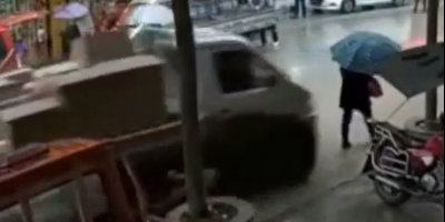 Umbrella Woman Nailed By Truck In China