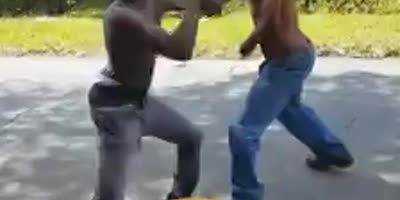 Guy smashed in the face with a rock during fight.