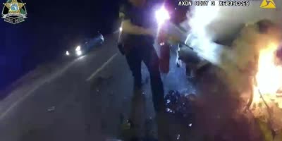 Cops Pull Woman From Burning Car